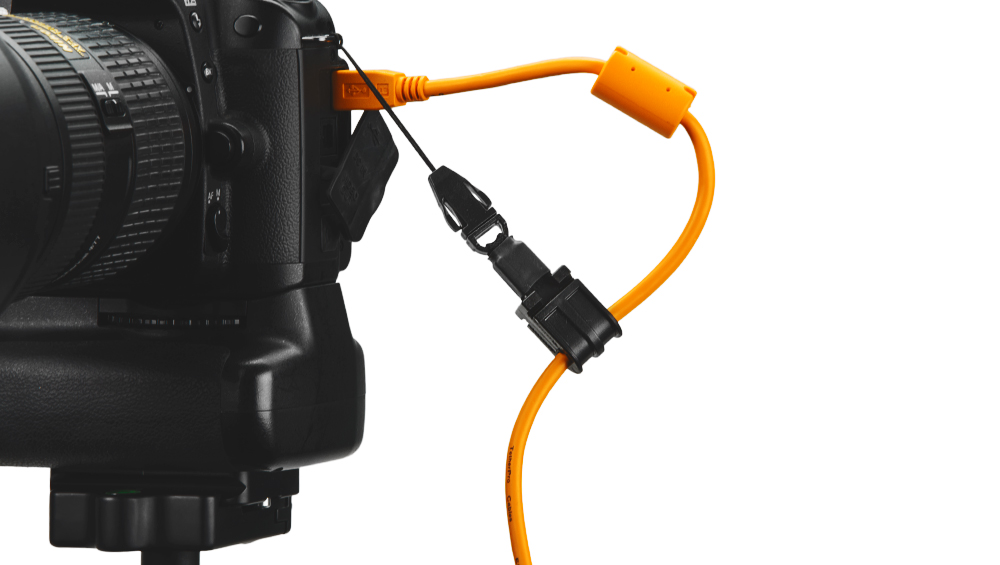 JerkStopper Camera Support connected to a camera and usb cable